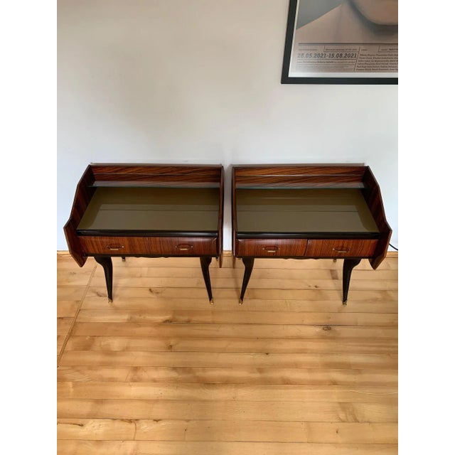 A pair of nightly, rosewood cabinets by Paolo Buffa from the 1950s. In original and very good condition. Excellent...