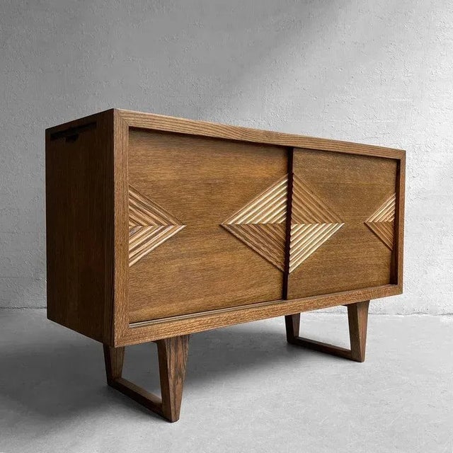 Mid-Century Modern, oak sideboard, credenza features superb design and craftsmanship with decoratively carved, diamond...