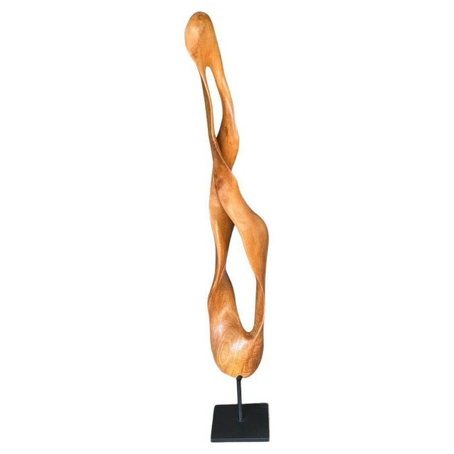 Impressive minimalist sculpture hand carved from a single piece of reclaimed mahogany wood. We added a natural oil...