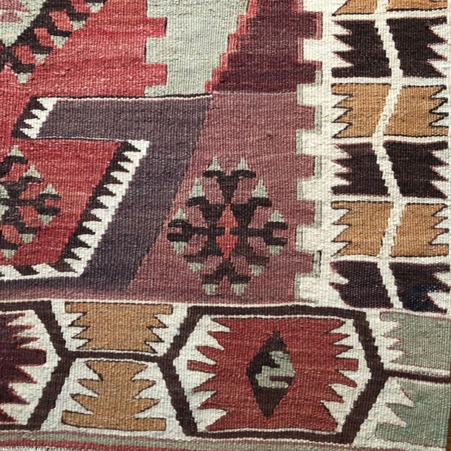 Small in scale but rich in character, this vintage Karapınar kilim is a beautifully expressive piece that brings energy...