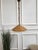 Eyecatching Italian 1960s handcrafted rattan pendant light with circular design. This suspension lamp has a bell shaped...