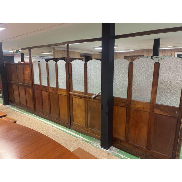 1930s bistro partition in chestnut and period plywood panels in its original condition, with a door in the middle. L=6m,...