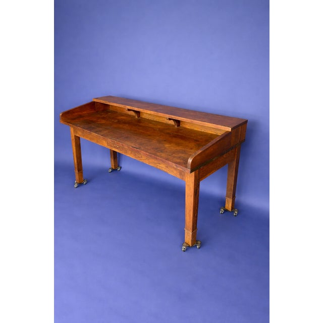 Vintage postal sorting desk featuring a raised gallery back, single center drawer, and warm natural finish. Could be used...
