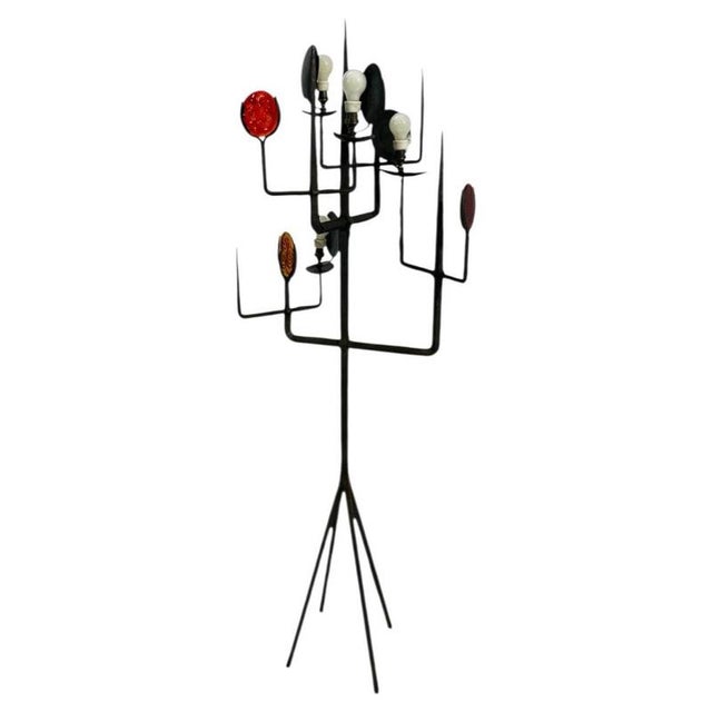 Electric floor lamp by Erik Höglund (1960s) featuring cast iron elements. It comprises a column and a base divided into...
