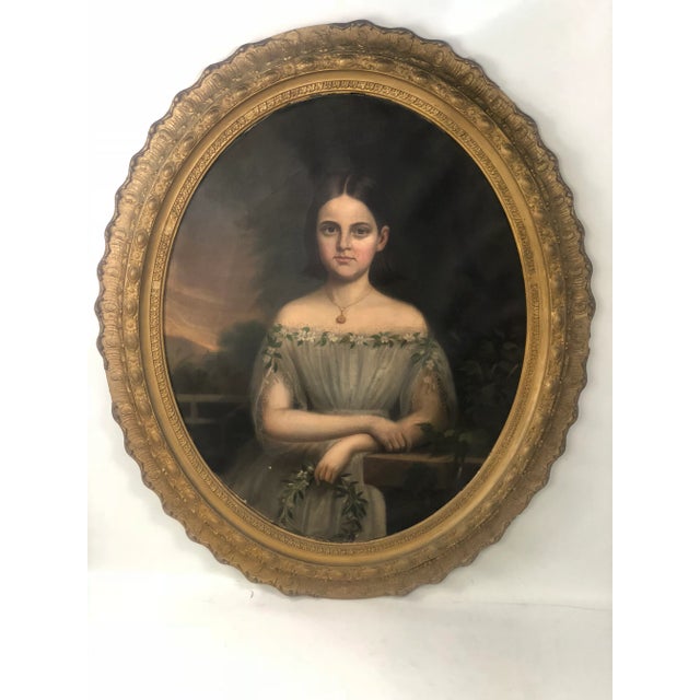 This expertly painted oil on canvass depicts a portrait of a young girl.This painting is signed and dated on back.We have...