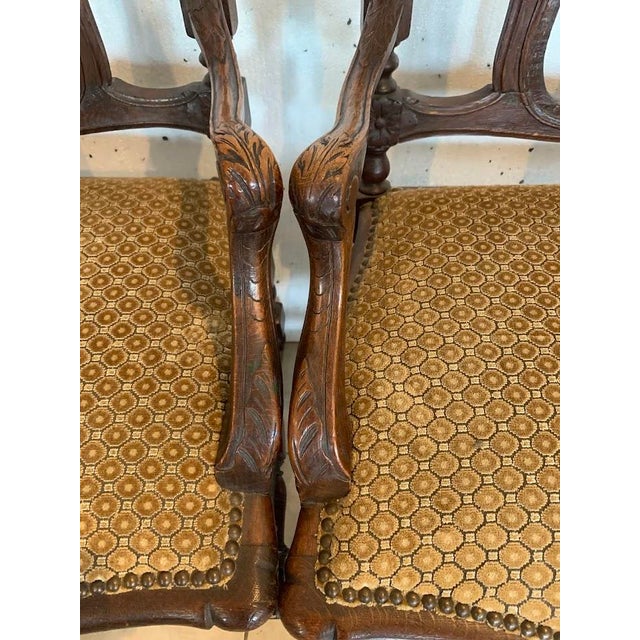 Pair of Flemish armchairs in solid oak Carved backs with openwork spindles Velvet seats Legs with stretchers Good...