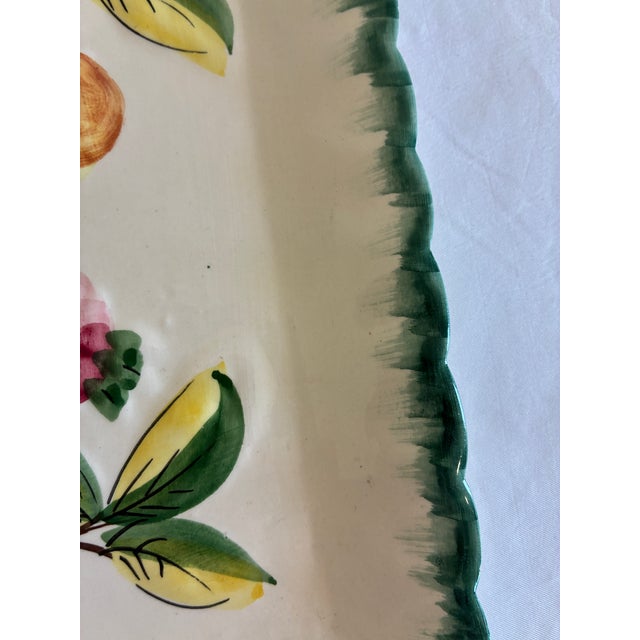 A charming vintage NSP Italy square platter featuring a hand-painted fruit motif with peaches and citrus branches in soft,...