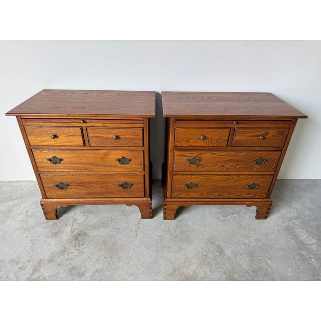 Elevate your bedroom with this timeless pair of Drexel Studio nightstands, crafted in beautifully grained solid wood and...