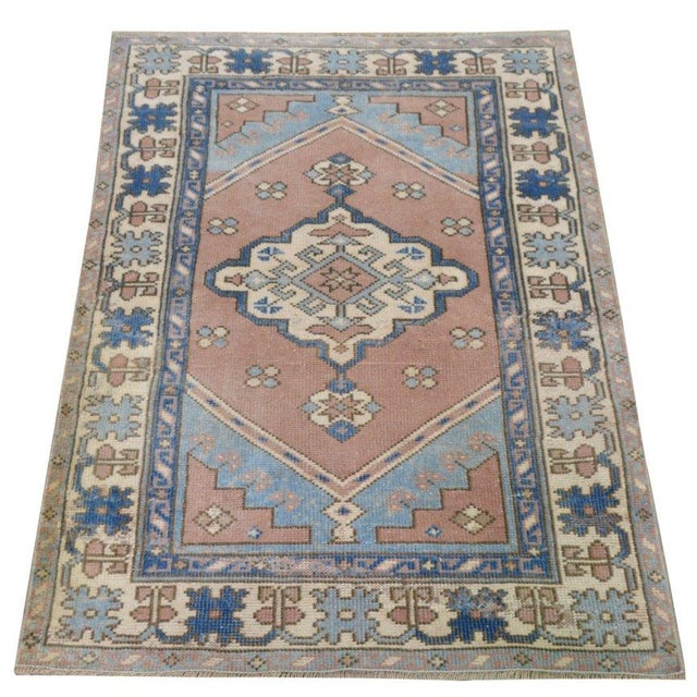 Hand-knotted with care using traditional rug-making techniques, this wool rug blends timeless craftsmanship with a modern...