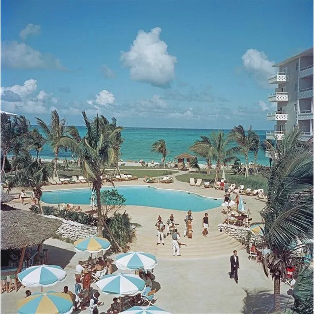 Nassau beach hotel (1959) limited estate stamped - grande xl (photo by slim aarons) the outdoor swimming pool at nassau...
