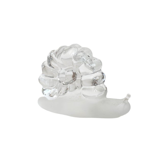 This elegant piece not only serves as a practical paperweight but also adds a touch of whimsy to any shelf or desk. Its...