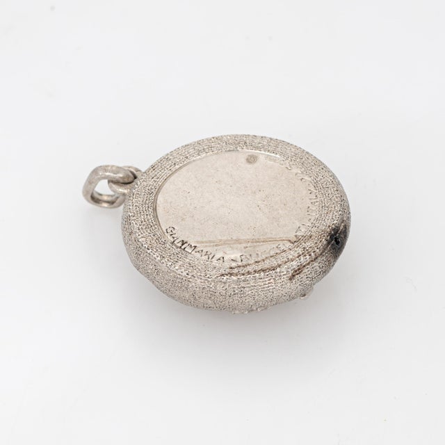 Stylish vintage Buccellati Aquarius zodiac pendant crafted in sterling silver (circa 1970s to 1980s). Dating to circa the...
