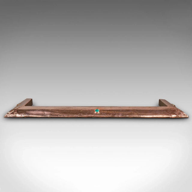 This is an antique Arts and Crafts fire kerb. An English, copper fireside surround with Ruskin-esque cabochon, dating to...