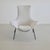 The 'Cosmos' lounge chair with a painted black tubular metal frame and a high-backed lounge seat, upholstered in a soft...