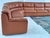 Large and impressive modular corner sofa produced in Italy during the 1970s, executed in cognac coloured leather with an...