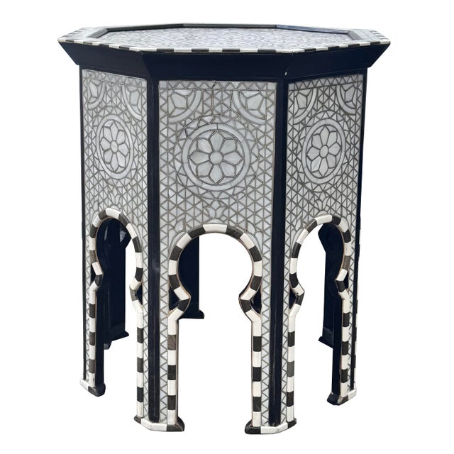 A striking vintage octagonal side table that beautifully combines traditional craftsmanship with a bold, contemporary...
