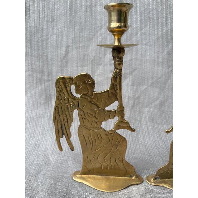 Vintage pair of solid brass winged celestial figural candlestick holders. Made in Taiwan for Lord & Taylor. The base and...