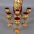 A refined Murano glass liqueur service, consisting of a bottle/decanter with stopper and six matching shot glasses. This...