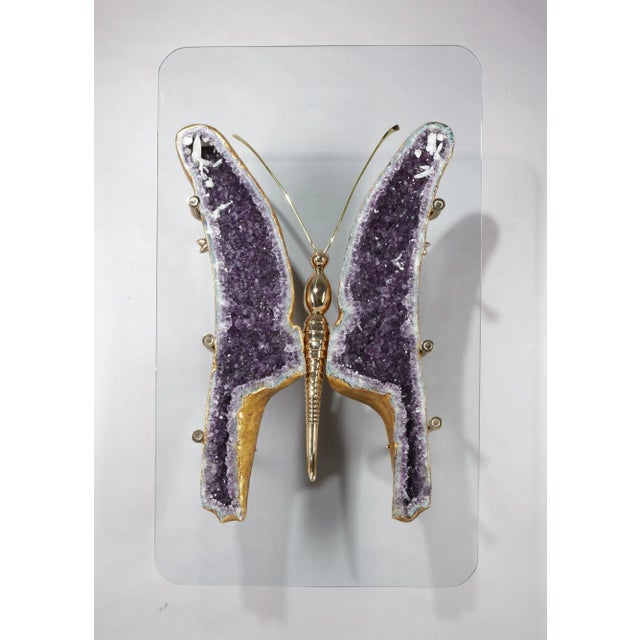 Butterfly coffee table made of Brazilian amethyst geodes gilded in 22k gold leaf and set on solid cast bronze creating a...