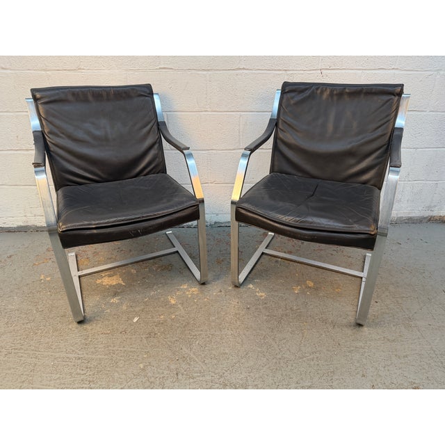 Striking mid-century modern leather and chrome armchairs designed by Rudolf Glatzel for Walter Knoll. These sophisticated...