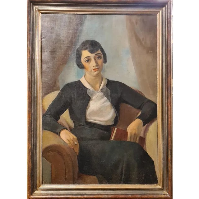 Oil portrait of a female figure executed in the style of Magical Realism typical of Casorati. This fine painting depicts a...