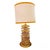 A pair of 1980s-style lamps made with a gilded brass frame, topped with individual Murano glass discs. The gold and mauve...