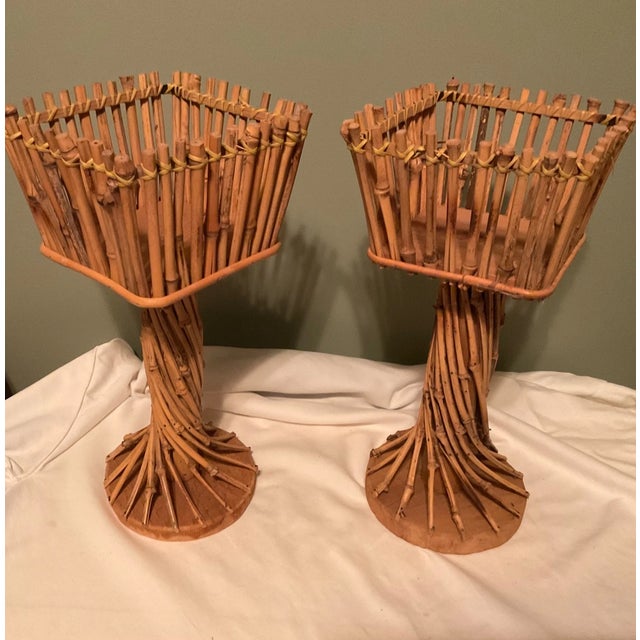 Bring timeless Mid-Century Modern charm to your home with this beautiful **set of two vintage natural rattan plant...