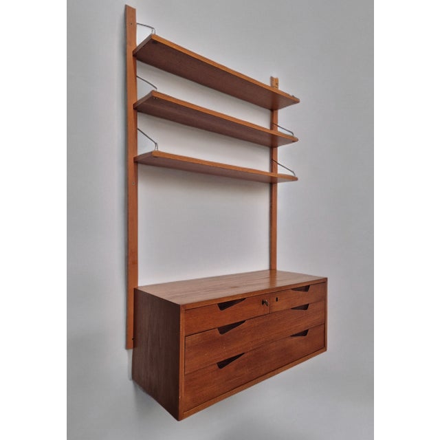 Rival Teak Storage Cabinet by Kjell Riise, 1960s, in Very Good conditions. Designed 1960 to 1969 This piece has an...