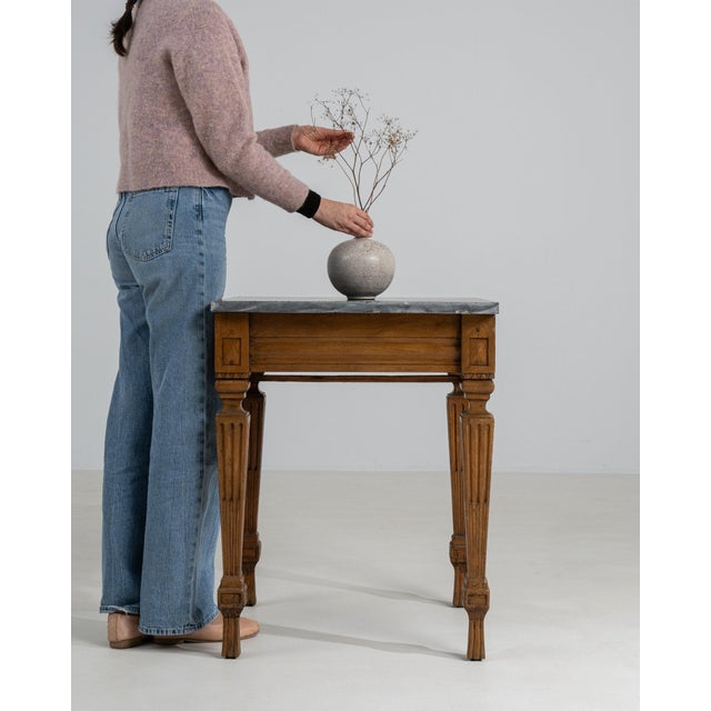 Fluted-leg marble-top side table in Golden Oak. Its golden oak finish sets off reeded tapered legs, inset grey marble top,...