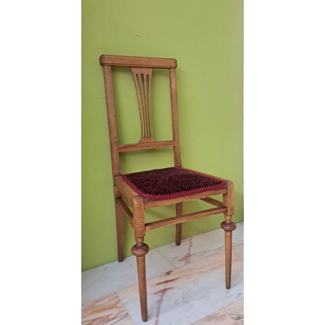 A beautiful chair from the 1920s, retaining its original upholstery. It is in the Art Nouveau style and features a central...