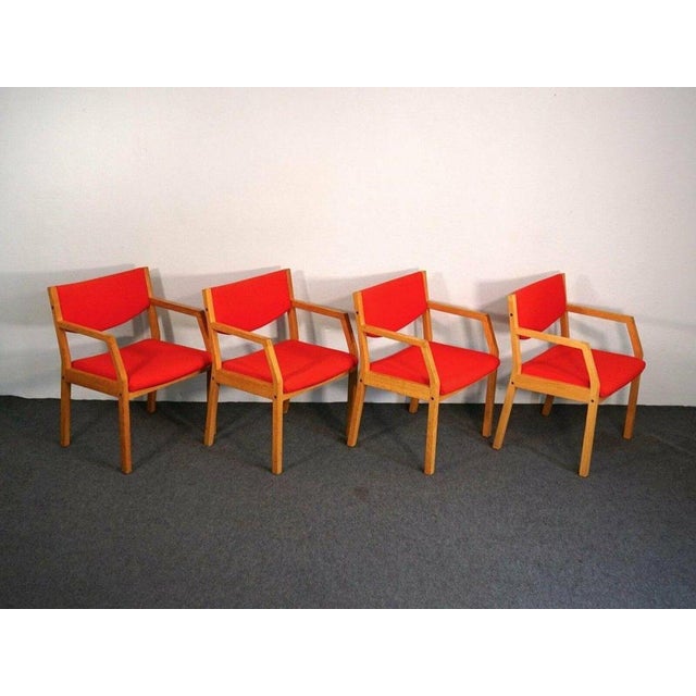 Object: Armchairs Era & Style: Scandinavia in the 1970s : Set of four comfortable armchairs in a sturdy oak frame with...
