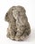 A French mid-20th-century cast stone garden statue depicting a seated elephant with rounded, stylized features and a...