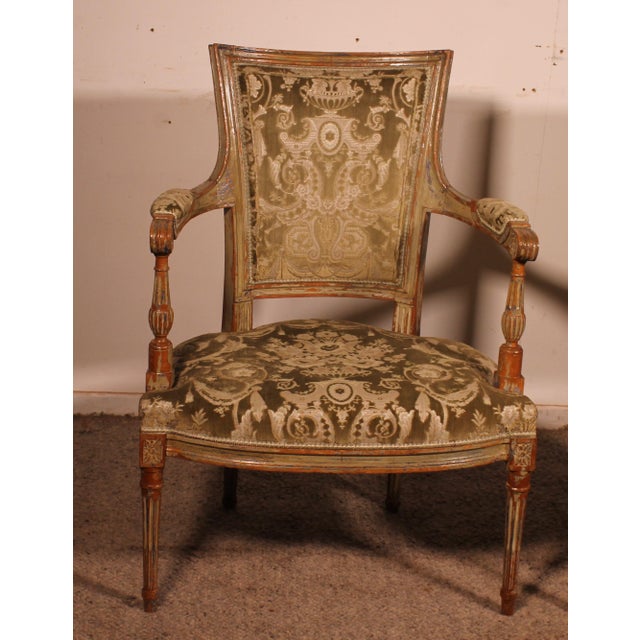 An elegant pair of Louis XVI period cabriolet armchairs, dating from the late 18th century, in carved wood. A very...