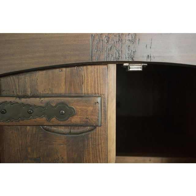 The Atlantic Collection by Crafters and Weavers features multi-wood panels and hand wrought decorative hardware to create...