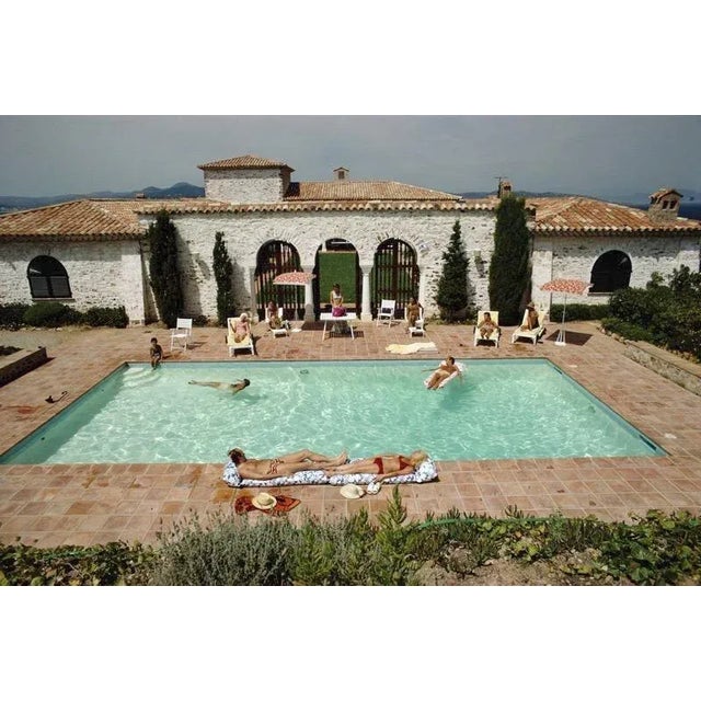 Pool in St Tropez 1970 Guests around the pool at a villa in St Tropez, France, circa 1970. (Photo by Slim Aarons) Slim...
