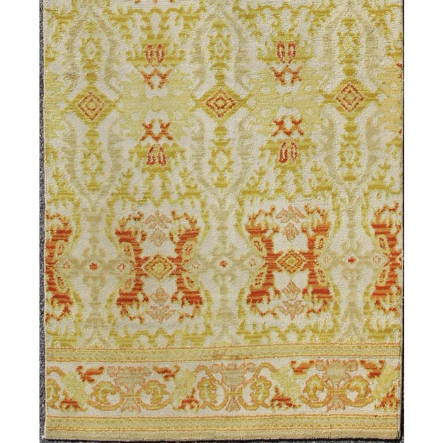 This stunning antique Spanish runner bears a lovely repeating pattern of sub-geometric designs paired with a colorful...