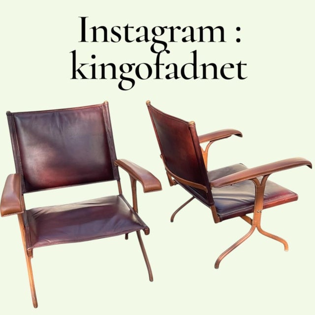 These armchairs exemplify Jacques Adnet's signature style, characterized by the combination of metal and saddle leather....