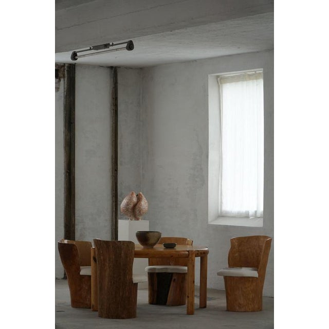 A beautiful set of four sculptural Stump Chairs, each hand-carved from a single solid tree trunk. These organic,...