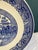 This beautiful Willow Ware-style transferware plate is a classic vintage find, showcasing a detailed chinoiserie scene...