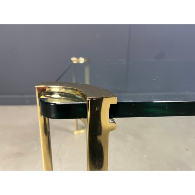 Brass and Glass Coffee Table in the style of Peter Ghyczy, 1970s, in Good conditions. Designed 1970 to 1979