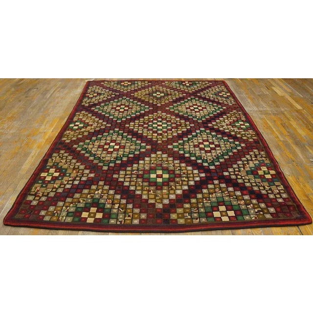 Antique American hooked rug, size: 6'0" x 8'10".