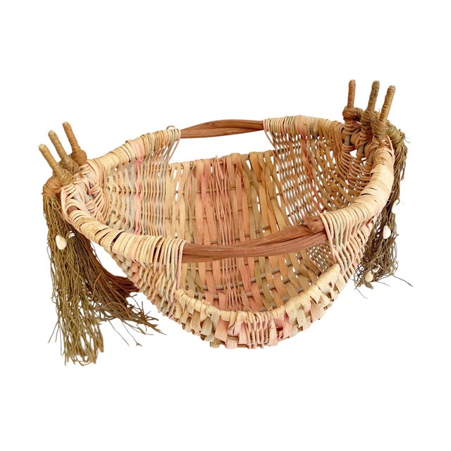 This handwoven twig handle basket combines nautical charm with vibrant colors, making it a perfect addition to any...