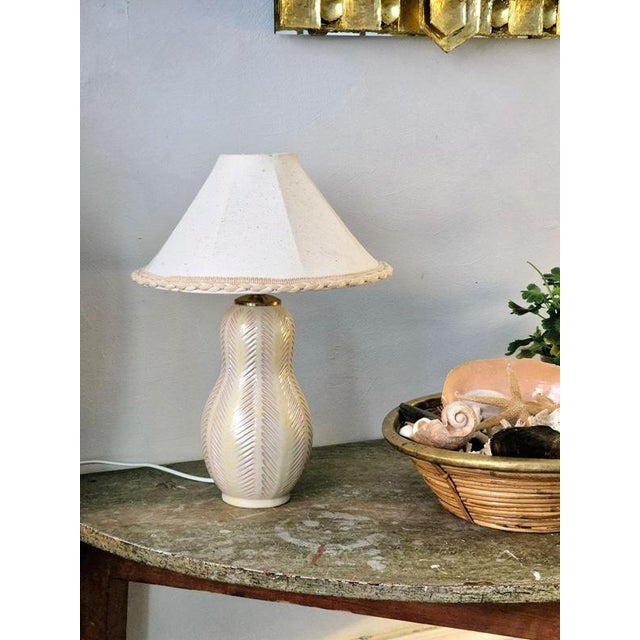 Beautiful earthenware table lamp with white glaze. Designed by Anna-Lisa Thomson for Upsala Ekeby Sweden, mid1900s....