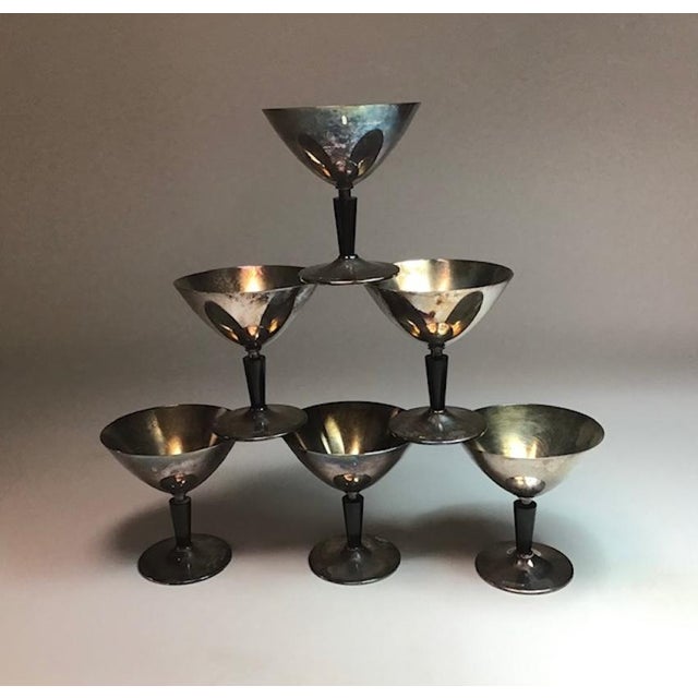 These are six beautiful cocktail glasses by folke arström. They are made of nickel silver with bakelite stems. These...