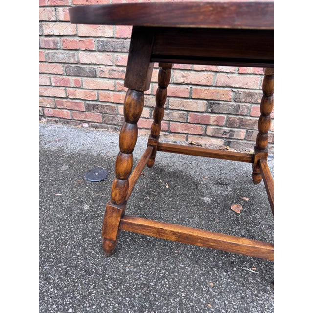 This is a beautiful 19th century English side table! The wood is dark and beautifully waxed, and the detail of the bobbin...