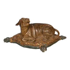 Fine European Carved and Painted Dog Lying on a Pillow
