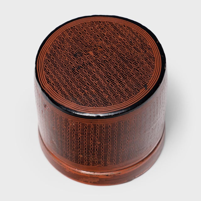An exquisite example of Burmese artistry, this palm-sized container dates to the late 19th century and was likely...