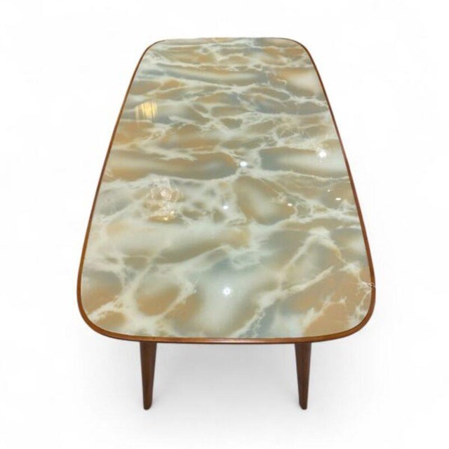 This Italian Mid-Century design table is everything a dining room needs. Simplicity, style, and quality; this dining table...