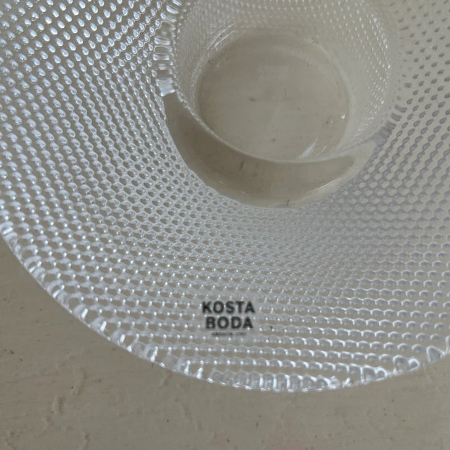 Simple, modern yet traditional at the same time, this pair of vintage Kosta-Boda votive candleholders in the Limelight...