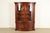 A gorgeous Georgian or Chippendale style lighted breakfront bookcase or dining cabinet By Baker Furniture, "Historic...